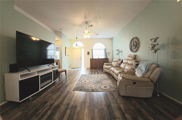 living room with ceiling fan and dark wood-type flooring