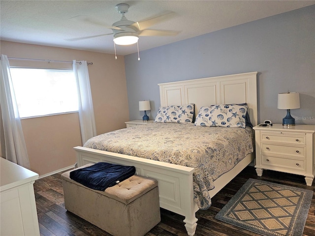 bedroom featuring a ceiling fan and dark wood-style flooring