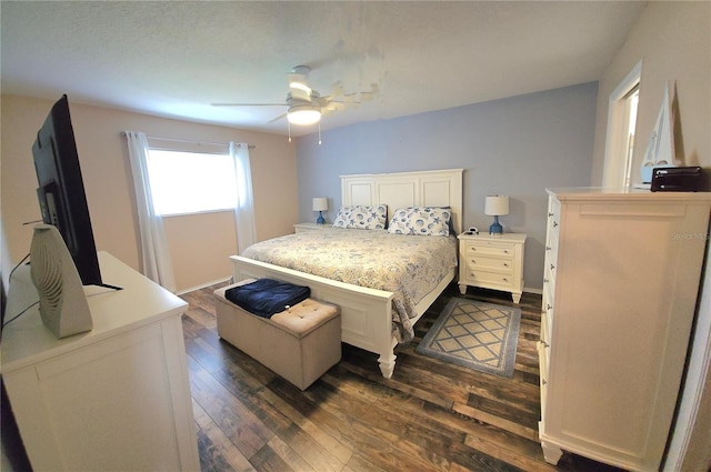 bedroom featuring dark wood-type flooring and ceiling fan