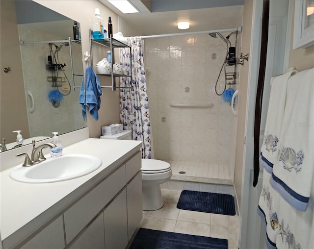 bathroom featuring toilet, vanity, tile patterned flooring, and walk in shower