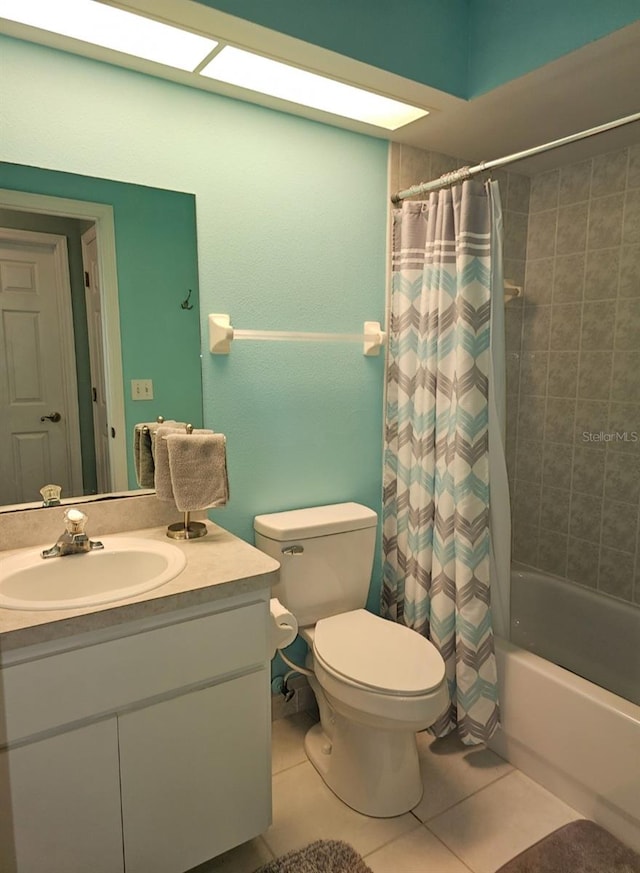 full bathroom featuring shower / tub combo, vanity, tile patterned flooring, and toilet