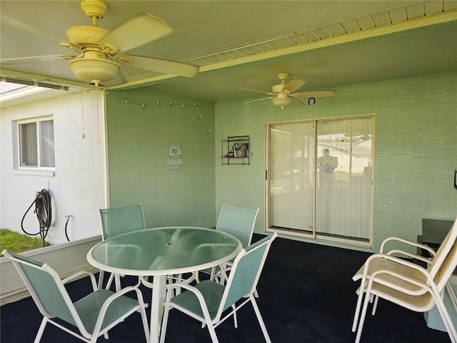 view of patio / terrace with ceiling fan and outdoor dining space