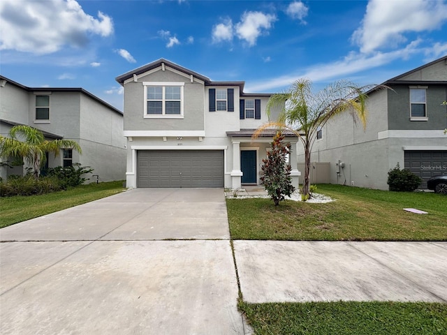 view of front property with a garage and a front yard