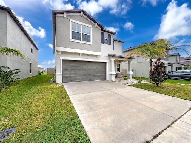 view of front of home with a garage and a front yard