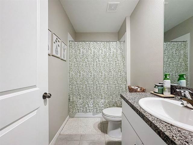 bathroom featuring a textured ceiling, vanity, curtained shower, toilet, and tile patterned floors