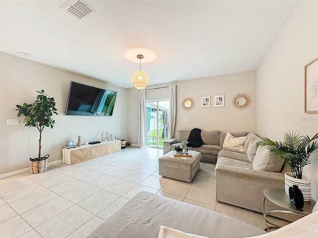 living room with light tile patterned flooring