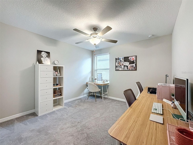 office with a textured ceiling, carpet flooring, and ceiling fan