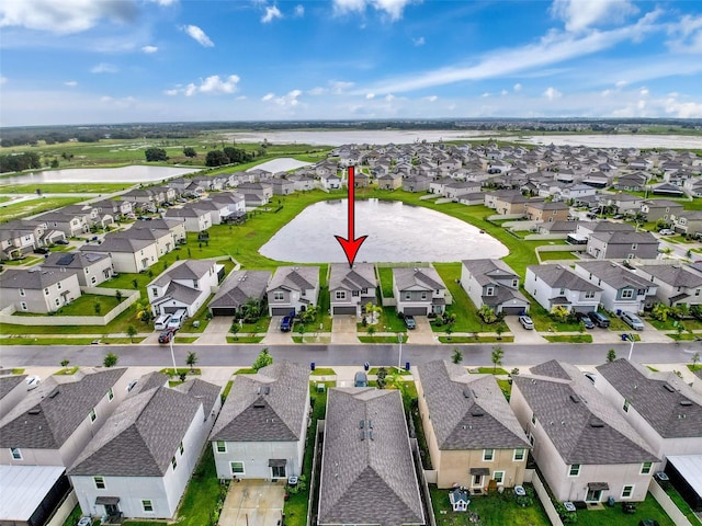 bird's eye view with a water view