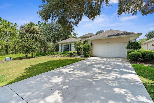 single story home featuring a front lawn and a garage