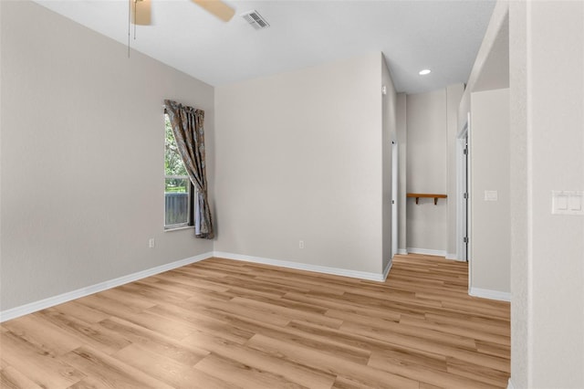 unfurnished room featuring ceiling fan and light hardwood / wood-style floors