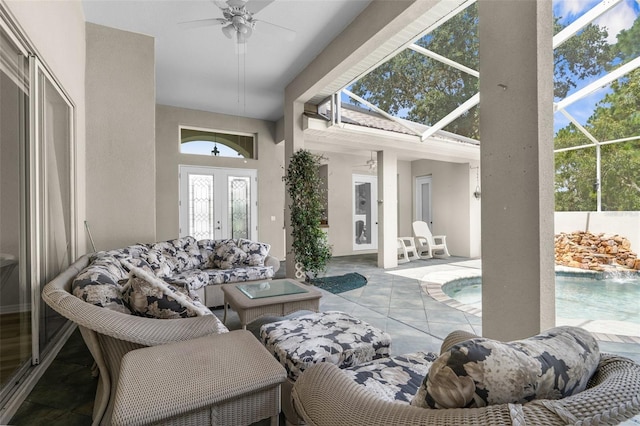 sunroom with ceiling fan and french doors