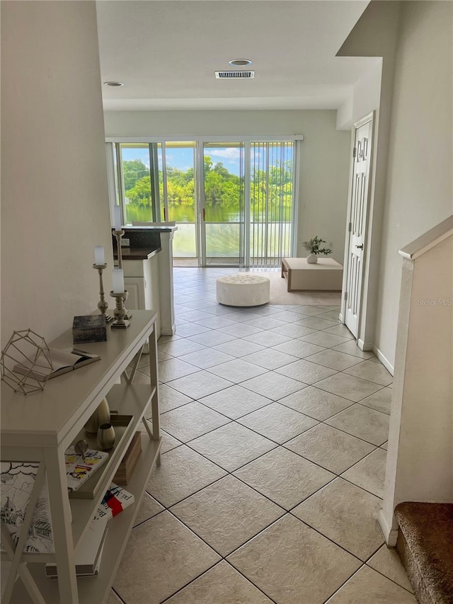 hallway featuring light tile patterned flooring