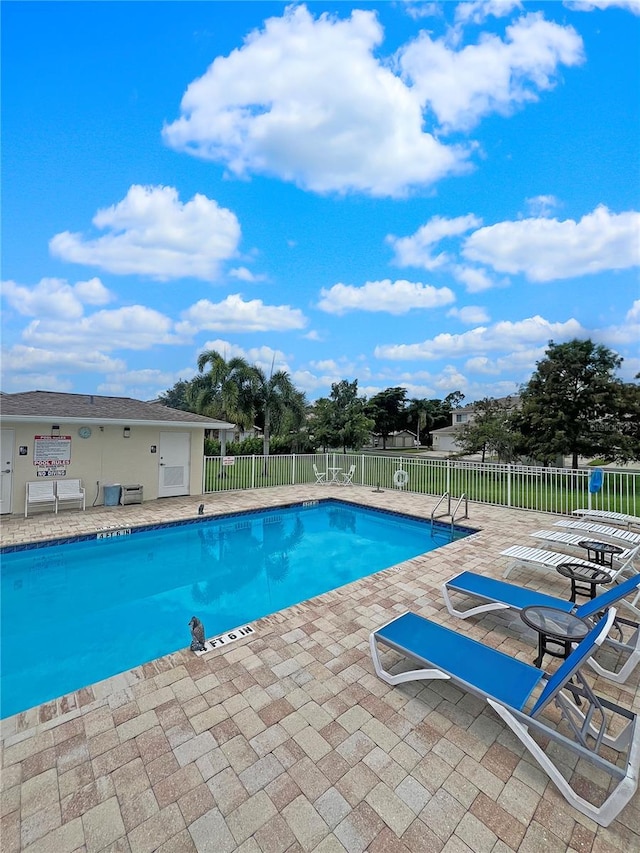 view of swimming pool featuring a patio area