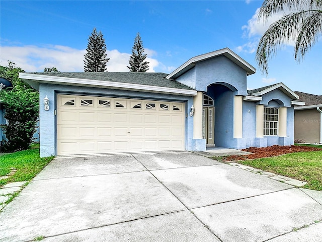 single story home with a garage