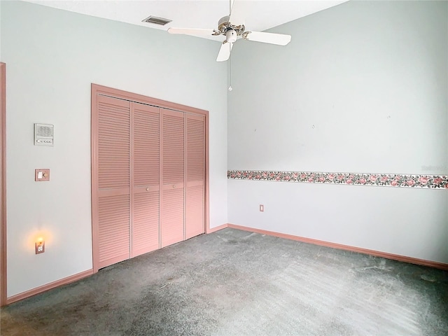 unfurnished bedroom featuring a closet, ceiling fan, and carpet flooring