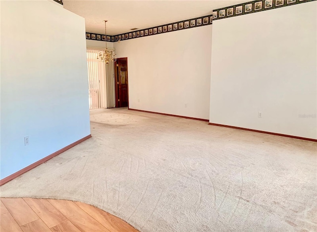 empty room with an inviting chandelier