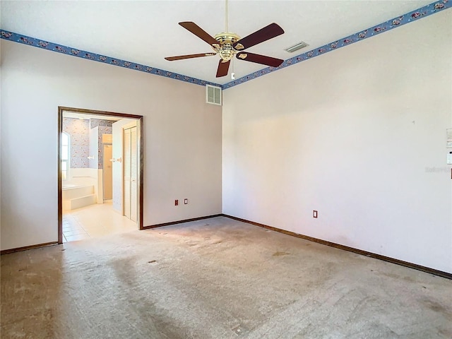 carpeted empty room with ceiling fan