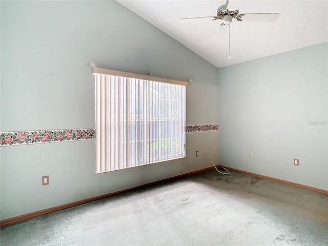 unfurnished room with ceiling fan, lofted ceiling, and light colored carpet