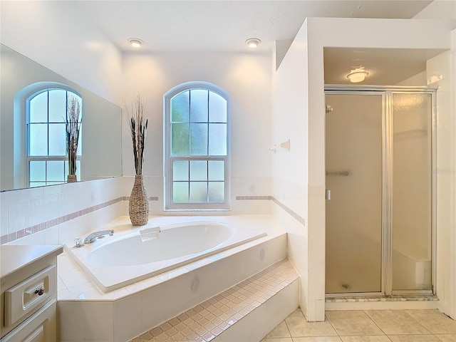 full bath with a stall shower, tile patterned flooring, and a wealth of natural light