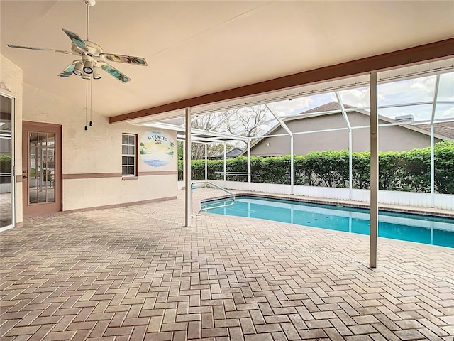 view of pool featuring ceiling fan, a patio area, a lanai, and a fenced in pool