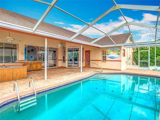 outdoor pool featuring a patio area, a lanai, and a ceiling fan