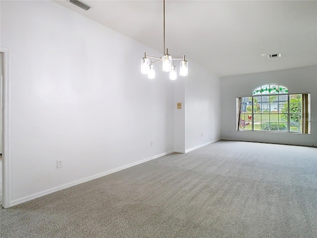 empty room with carpet floors, baseboards, visible vents, and a chandelier