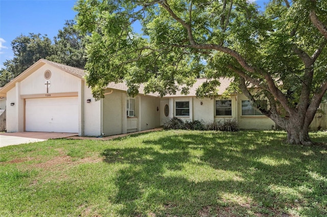 ranch-style home featuring a garage, driveway, a front yard, and stucco siding