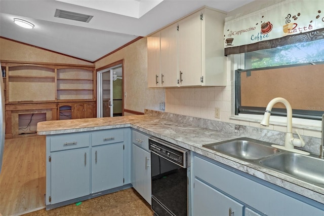 kitchen with visible vents, dishwasher, lofted ceiling, a peninsula, and a sink