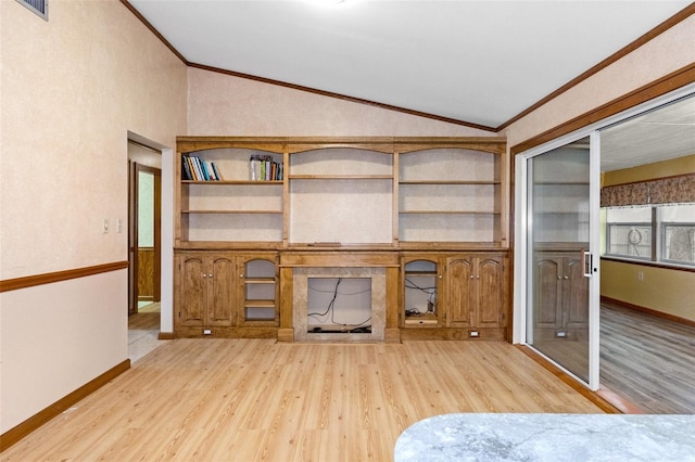 unfurnished living room with lofted ceiling, light wood-style flooring, and crown molding