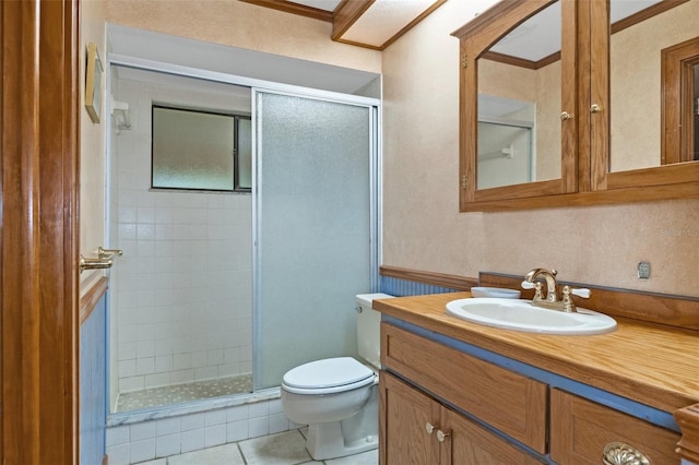 bathroom with tile patterned flooring, a shower stall, toilet, and vanity