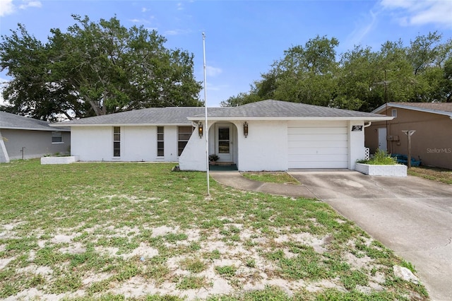 ranch-style house with a front yard and a garage