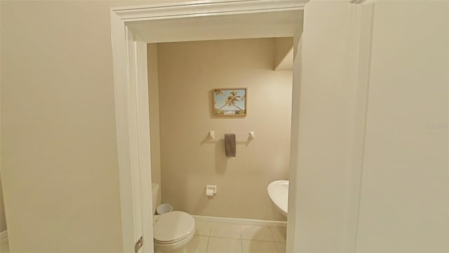 bathroom featuring toilet and tile patterned floors