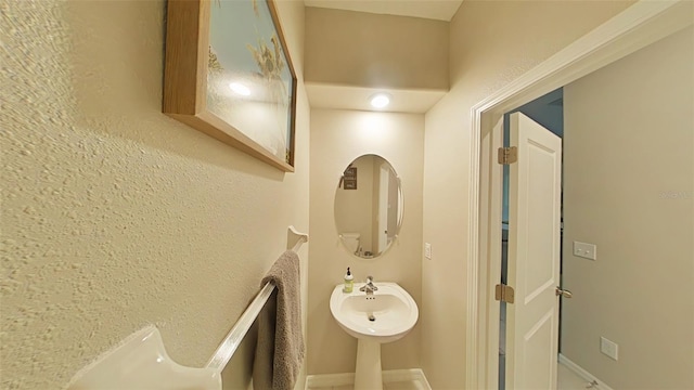 31941 Blue Passing Loop, Wesley Chapel, FL 33545 - bathroom featuring baseboards