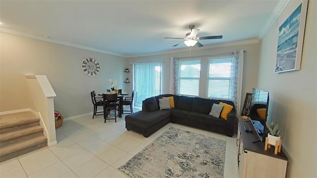 tiled living room with ornamental molding and ceiling fan