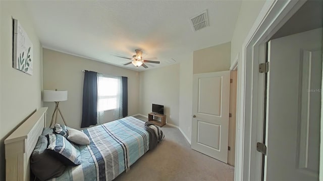 carpeted bedroom featuring ceiling fan