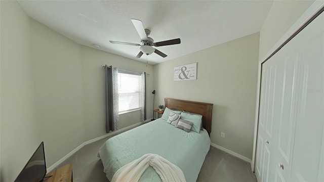 bedroom with carpet, ceiling fan, and a closet