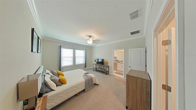 carpeted bedroom featuring a textured ceiling, crown molding, ceiling fan, and ensuite bathroom