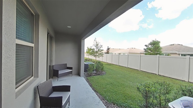 view of yard featuring an outdoor living space, a patio, and central AC unit