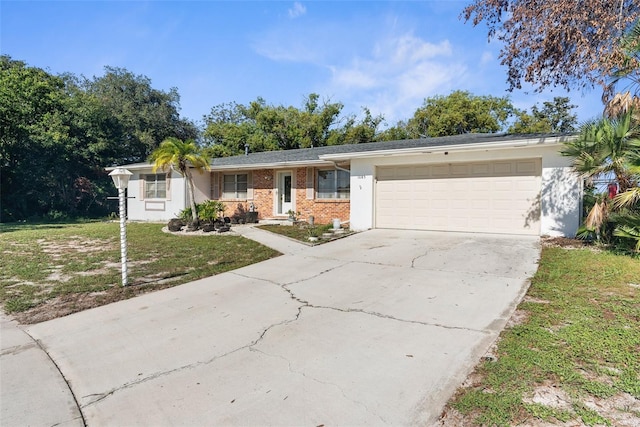 ranch-style house with a garage and a front lawn