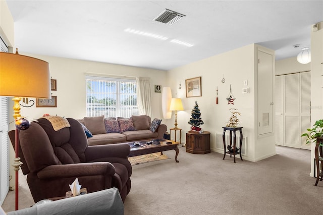 living room featuring light carpet