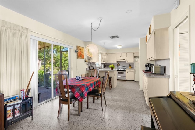 dining space featuring sink