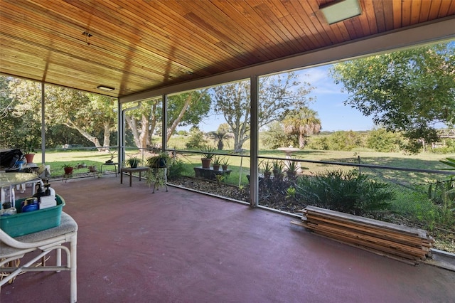 unfurnished sunroom featuring wood ceiling