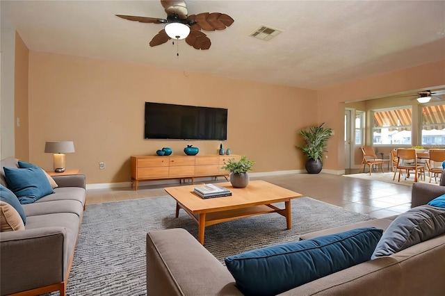 tiled living room with ceiling fan