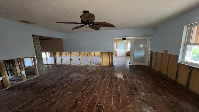 unfurnished room with dark wood-type flooring and ceiling fan