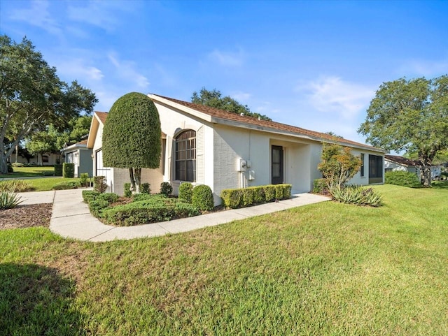 view of home's exterior with a lawn