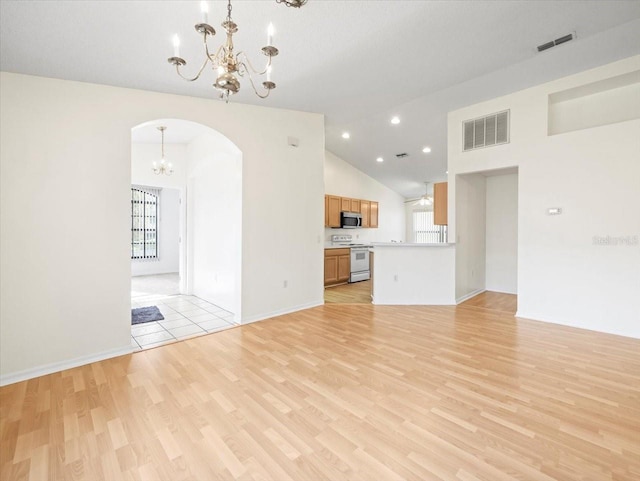 unfurnished living room with light hardwood / wood-style flooring and a wealth of natural light