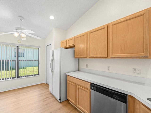 kitchen with stainless steel dishwasher, vaulted ceiling, ceiling fan, and white refrigerator with ice dispenser