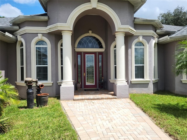 entrance to property with a yard