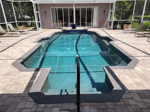 view of pool featuring a lanai and a patio