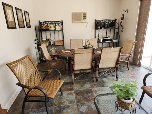 dining space featuring a wall unit AC